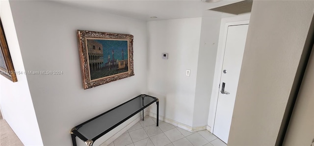 corridor with light tile patterned flooring