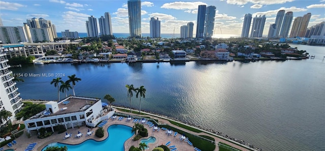 birds eye view of property with a water view