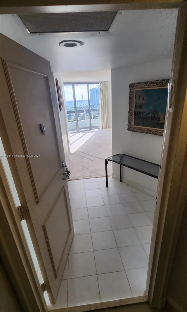 hallway featuring light tile patterned flooring