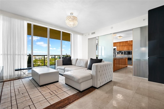 living room featuring floor to ceiling windows and an inviting chandelier