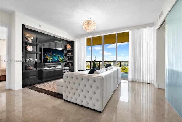 living room featuring built in features, an inviting chandelier, and floor to ceiling windows