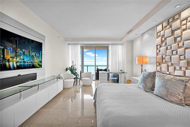 bedroom featuring access to exterior and floor to ceiling windows