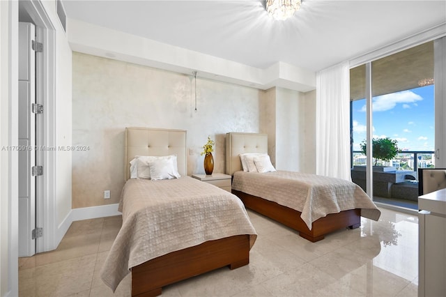 bedroom featuring floor to ceiling windows and access to outside