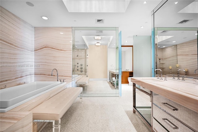 bathroom featuring shower with separate bathtub and vanity