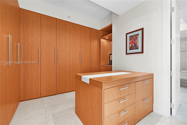 walk in closet featuring light tile patterned floors