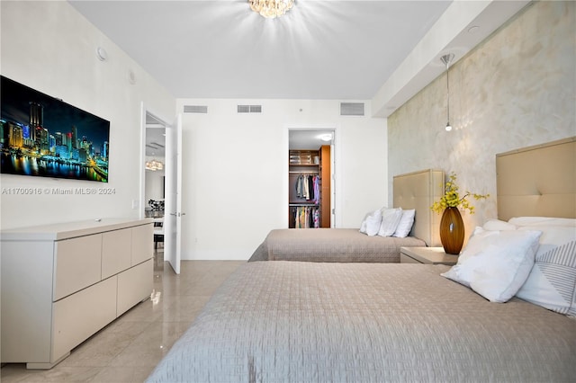 bedroom featuring a spacious closet and a closet