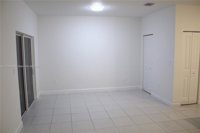 spare room with light tile patterned floors