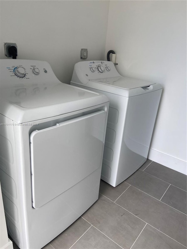 laundry area featuring tile patterned flooring and washer and dryer