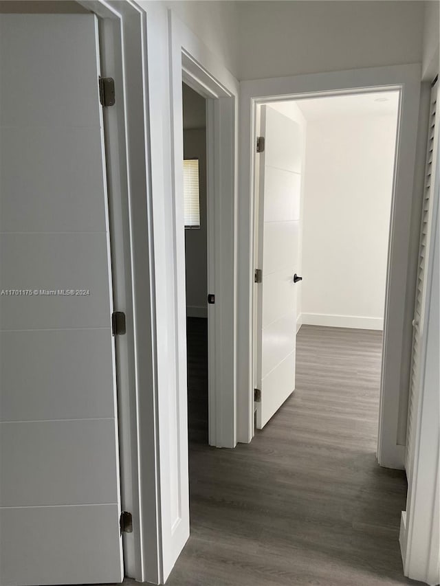 hallway featuring dark hardwood / wood-style floors