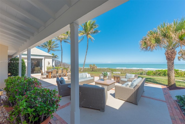 view of patio featuring outdoor lounge area and a water view