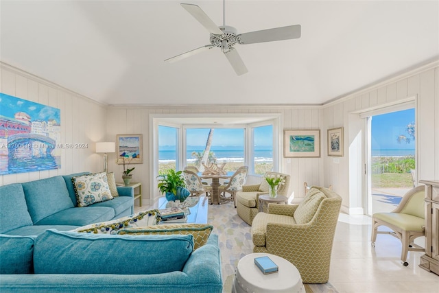 living room featuring light tile patterned floors, a water view, ceiling fan, and crown molding