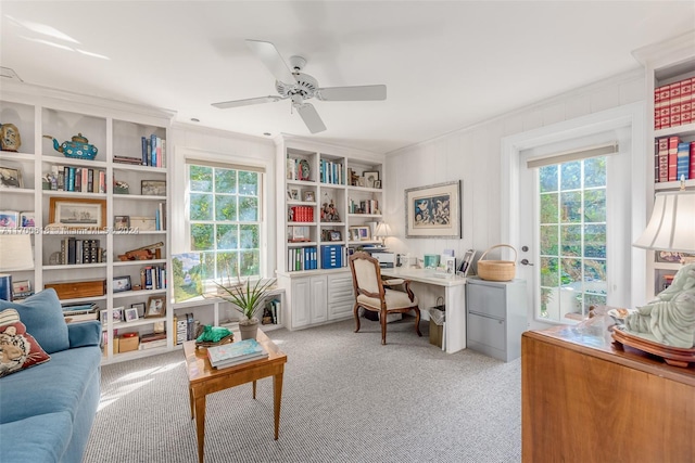 carpeted home office featuring plenty of natural light, ceiling fan, and crown molding