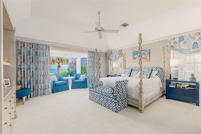 carpeted bedroom with vaulted ceiling, multiple windows, and ceiling fan