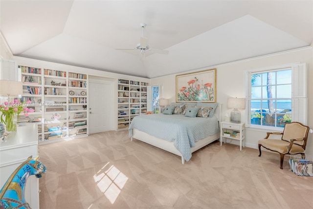 bedroom with carpet floors, a raised ceiling, and ceiling fan