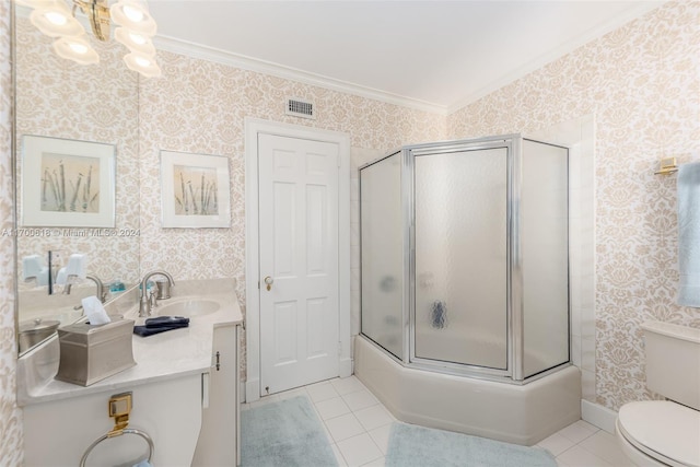 full bathroom with tile patterned floors, toilet, vanity, and ornamental molding