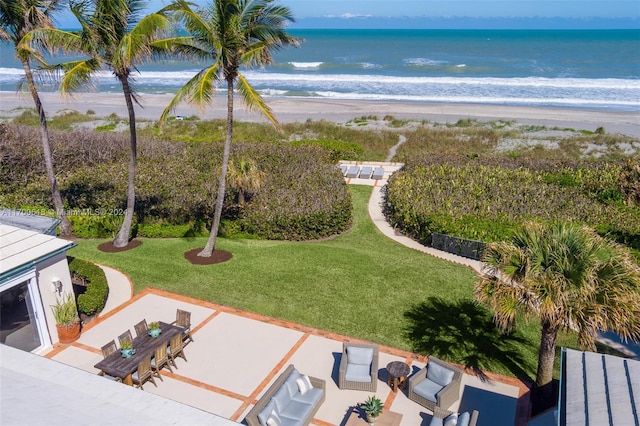 exterior space with a water view and a beach view