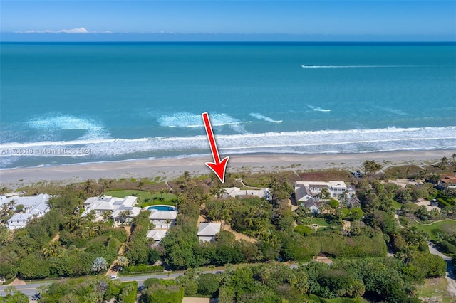 bird's eye view featuring a water view and a view of the beach