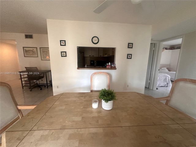 dining room with a textured ceiling