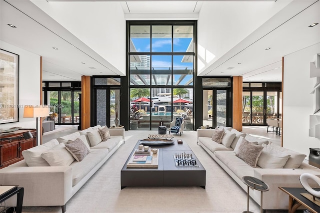 living room featuring french doors and a wall of windows