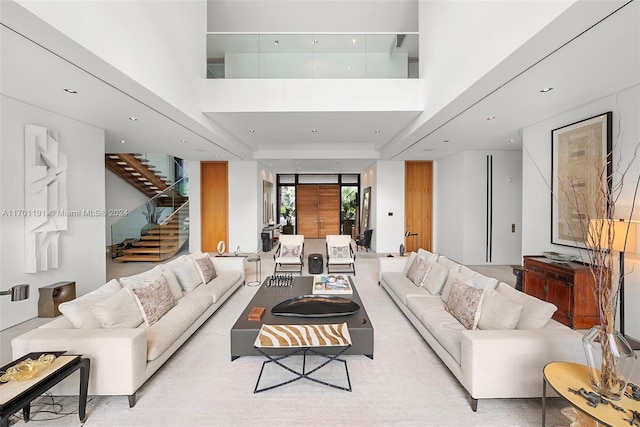 living room with a high ceiling