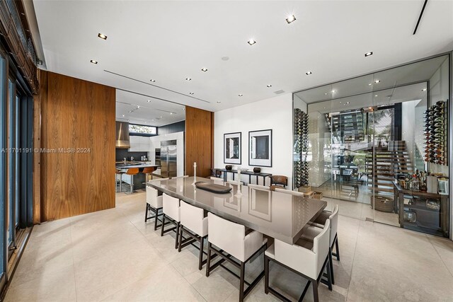 dining area featuring wood walls