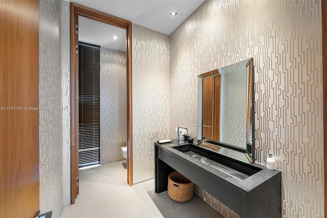 bathroom featuring tile patterned floors and toilet