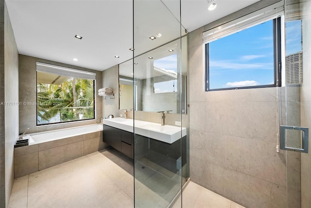 bathroom featuring separate shower and tub, tile patterned flooring, and vanity