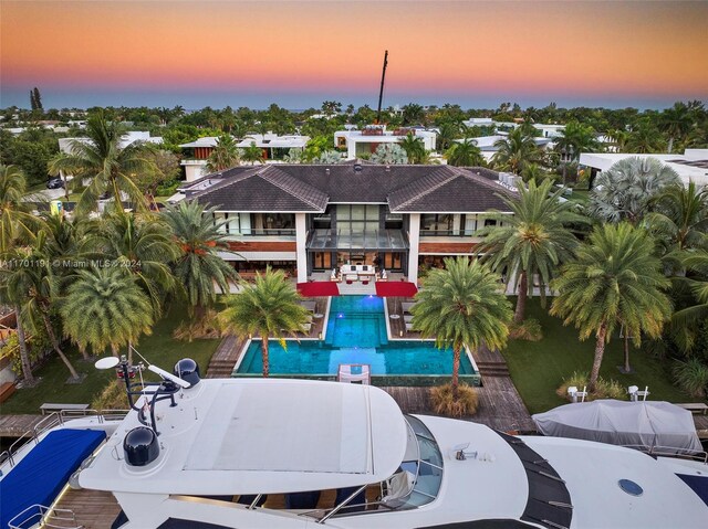 view of pool at dusk