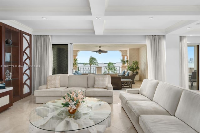 tiled living room with ceiling fan, crown molding, beamed ceiling, and coffered ceiling