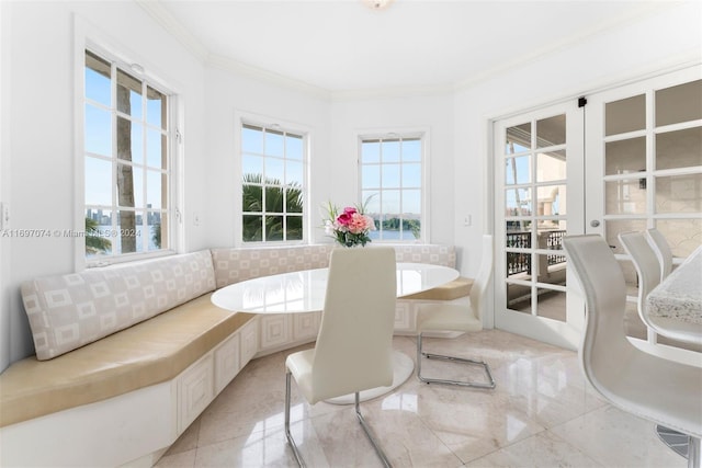 sunroom / solarium featuring breakfast area