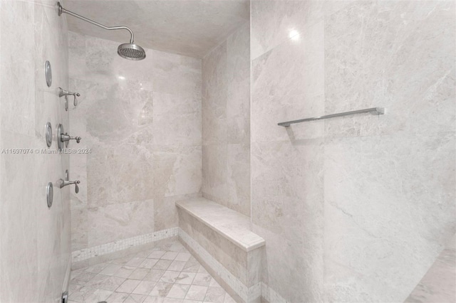 bathroom featuring tiled shower