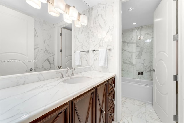 bathroom featuring combined bath / shower with glass door and vanity