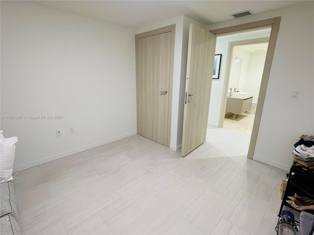 unfurnished bedroom with a closet