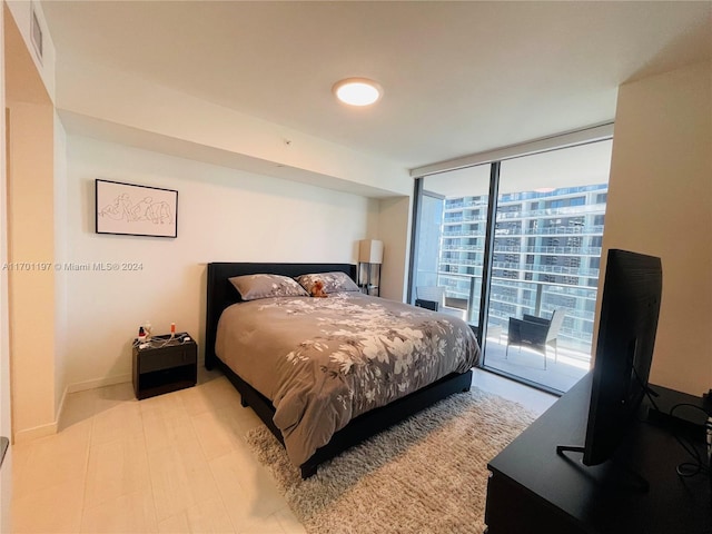 bedroom featuring floor to ceiling windows and access to outside