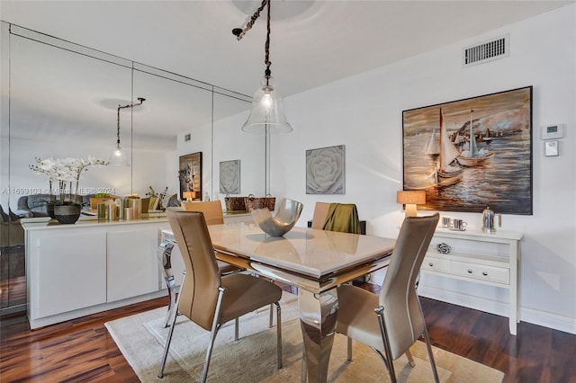 dining area featuring dark hardwood / wood-style flooring