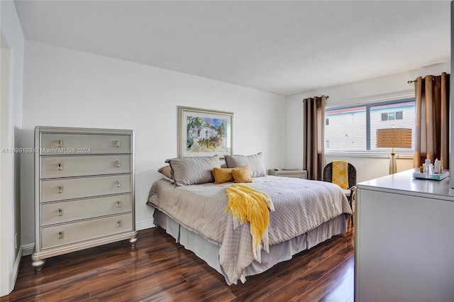 bedroom featuring dark wood-type flooring