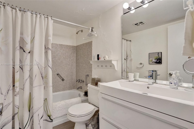 full bathroom with vanity, shower / bath combination with curtain, and toilet