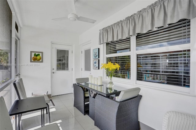 sunroom / solarium featuring ceiling fan