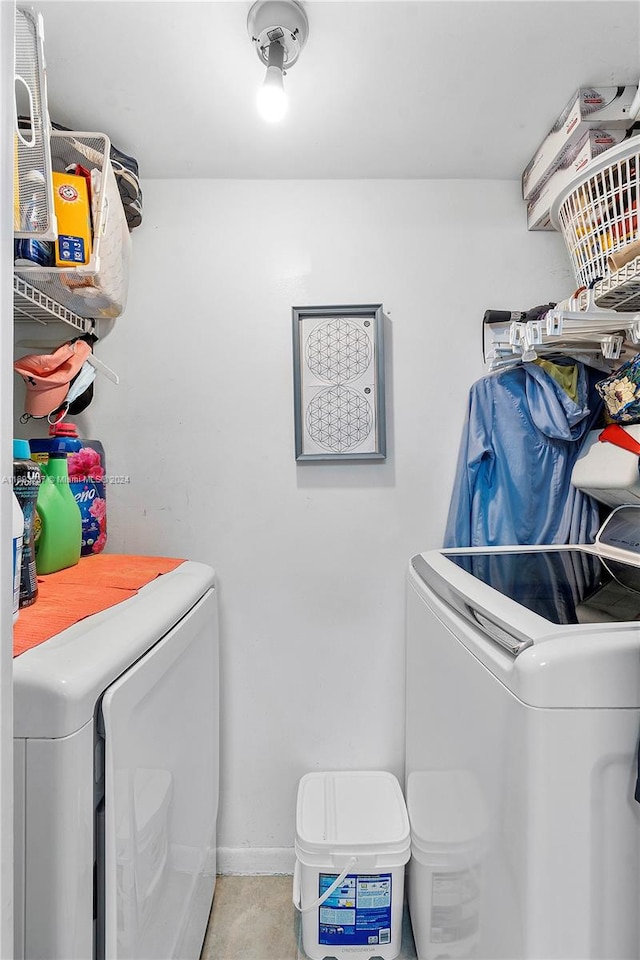 clothes washing area featuring washing machine and dryer