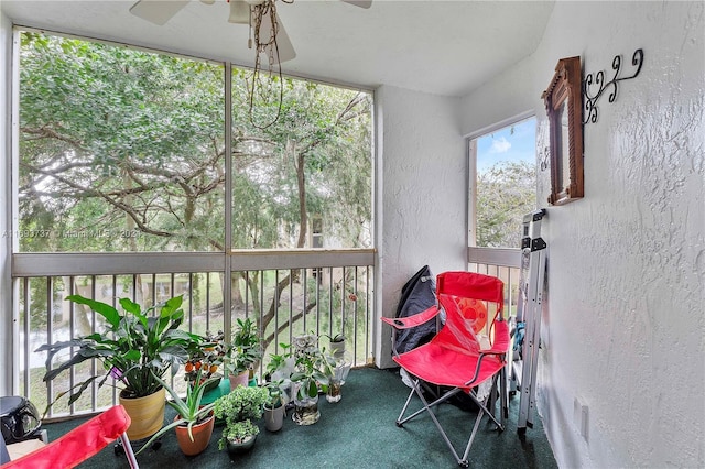 sunroom featuring ceiling fan