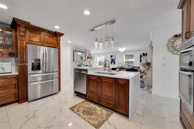 kitchen with ornamental molding, pendant lighting, stainless steel appliances, and sink