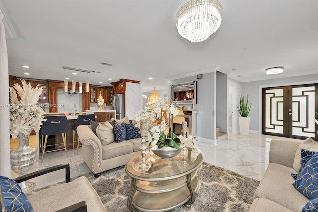 living room with an inviting chandelier, crown molding, and sink