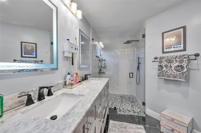 bathroom with vanity and a shower with door