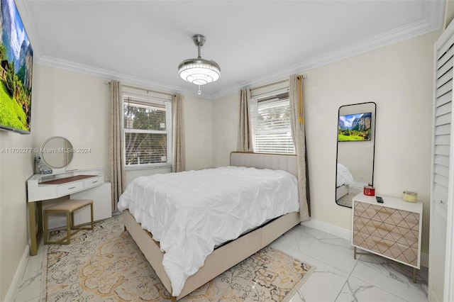 bedroom featuring ornamental molding and multiple windows