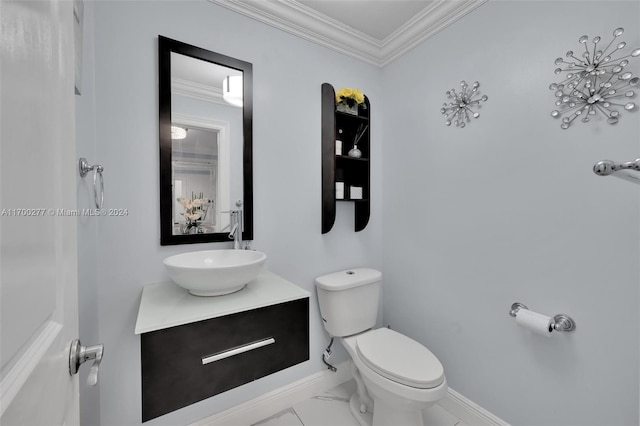 bathroom with vanity, toilet, and crown molding