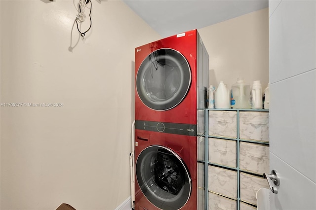 laundry area with stacked washer and clothes dryer