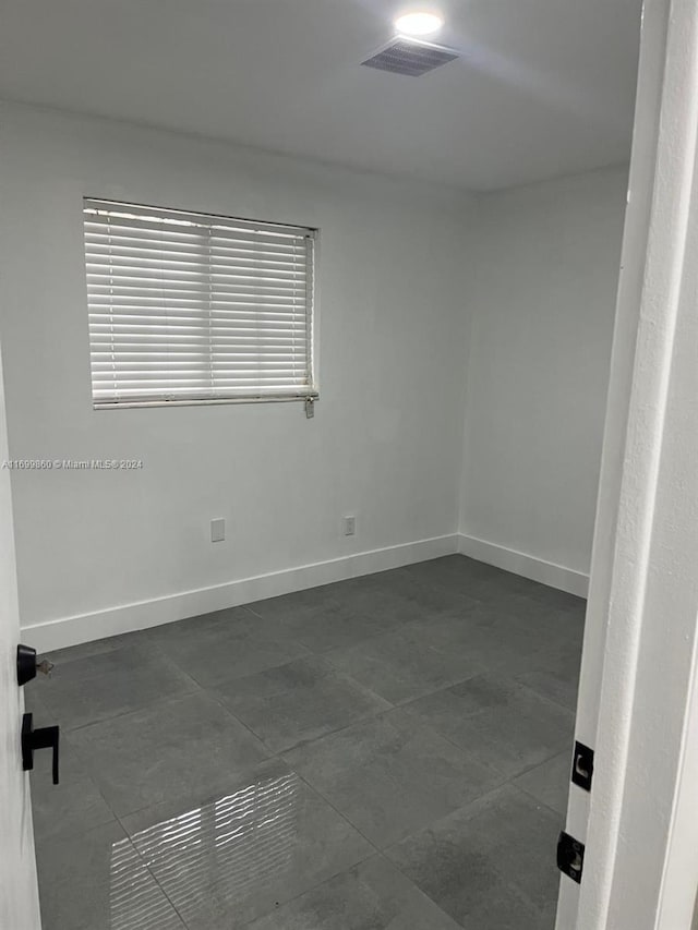 unfurnished room featuring a wealth of natural light