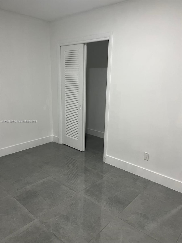 unfurnished bedroom with a closet