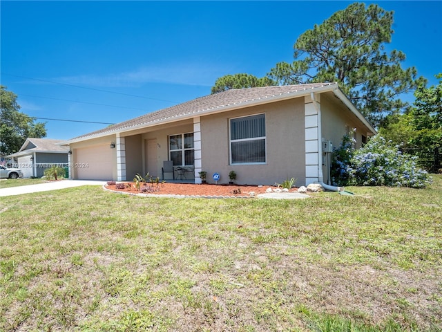 ranch-style home featuring a garage and a front lawn