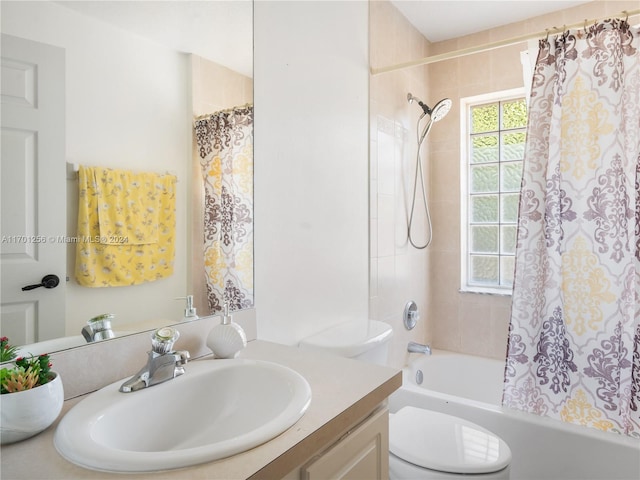 full bathroom featuring vanity, toilet, and shower / bath combo with shower curtain